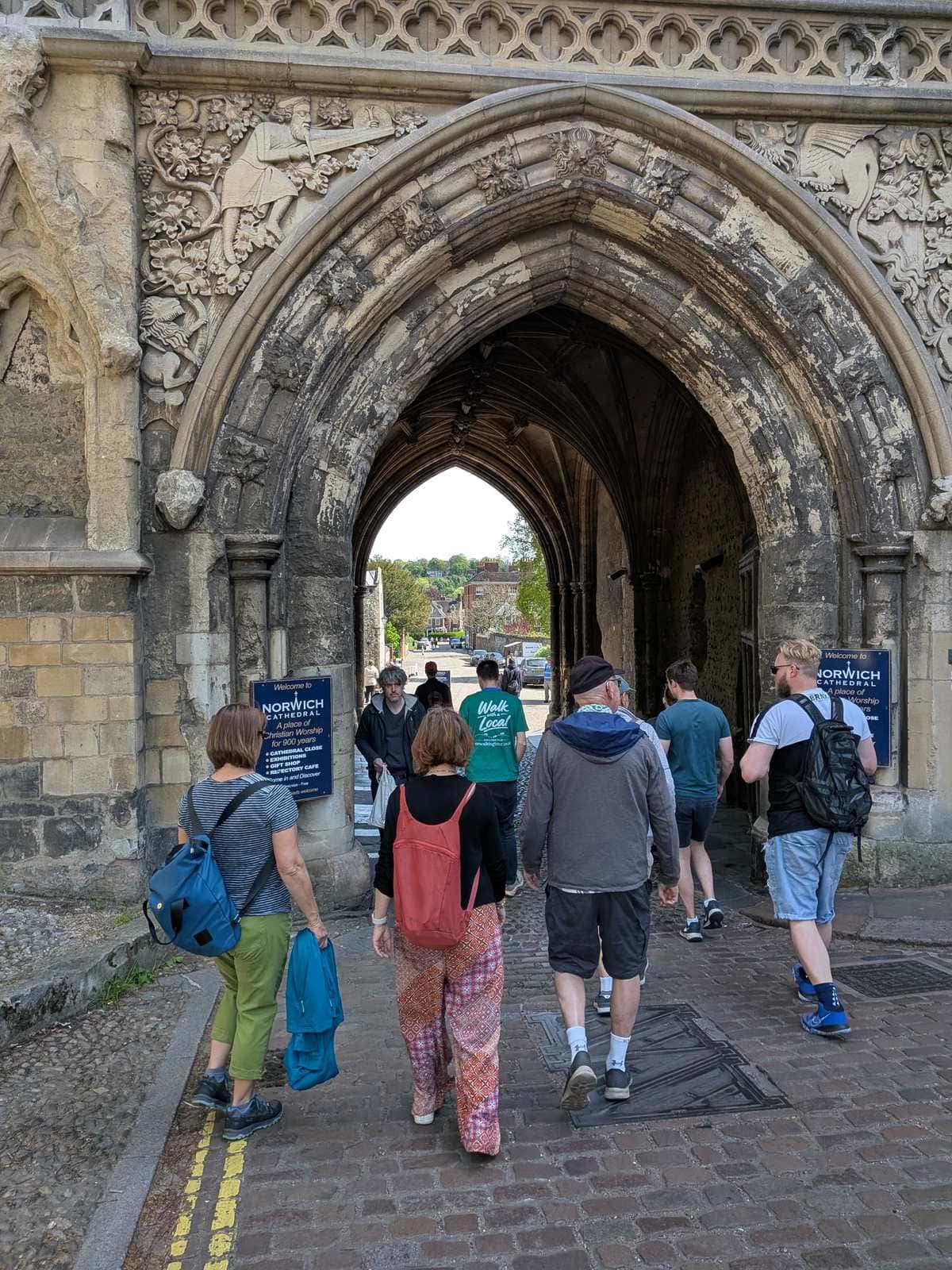 Tour group walking through the Ethelbert Gate into the Cathedral Close