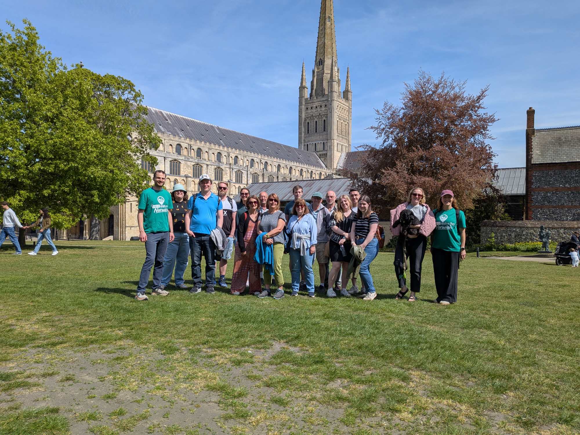 Walking tour group on the Cathedral lawn, Norwich.