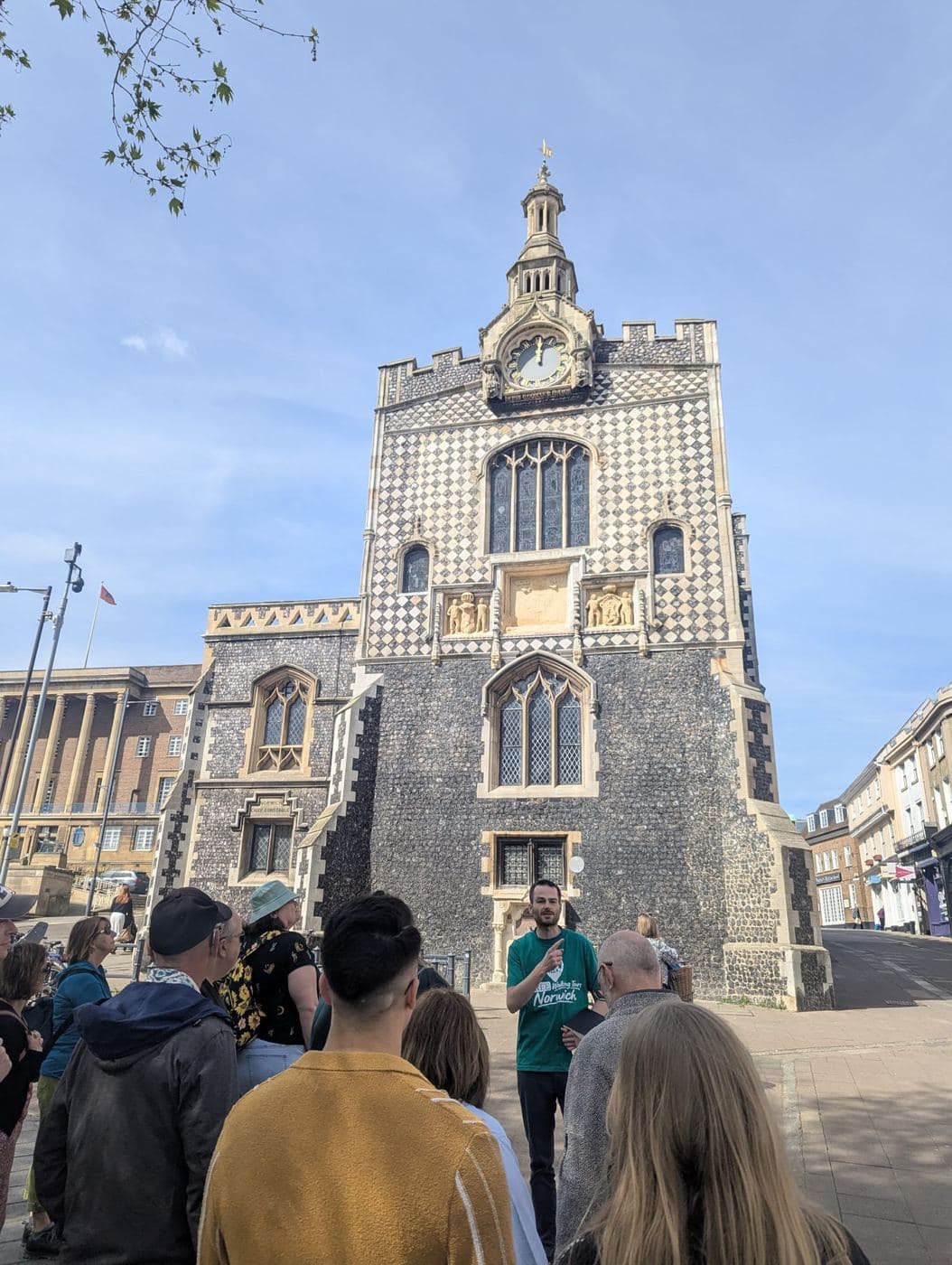 Tom explaining the chequerboard flintwork on Norwich Guildhall to a small tour group